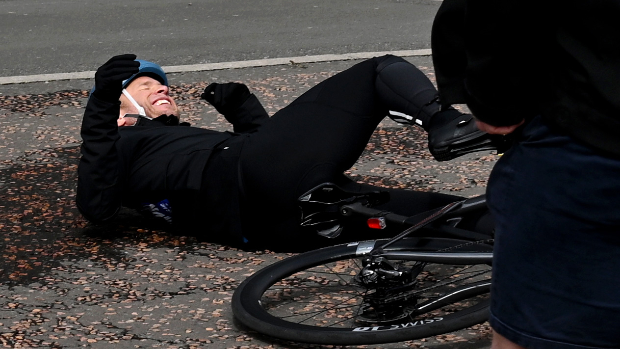 Olly Murs falls off bicycle at the start line for 'Olly Murs: Into The Unknown' at Old Trafford