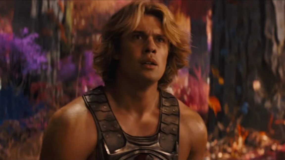 very muscular young man with wave blond hair in a He-Man costume.