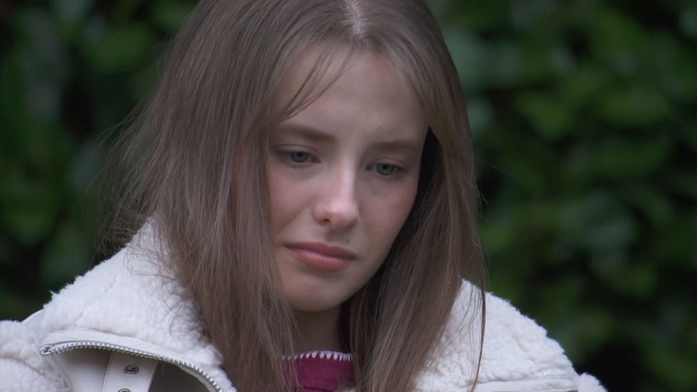 Hollyoaks, Dee Dee Hutchinson hollyoaks, dee dee hutchinson outdoors wearing a fluffy pink coat looking sad
