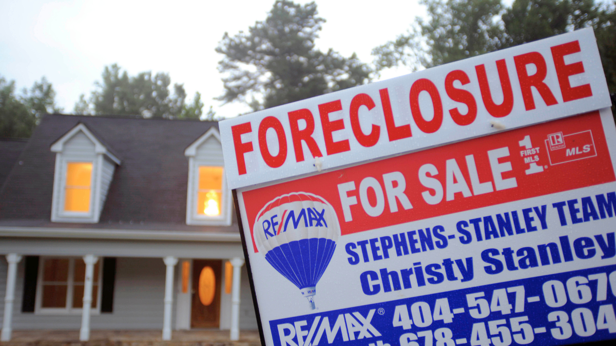 A foreclosure sign is posted outside of a home in Loganville, Georgia.