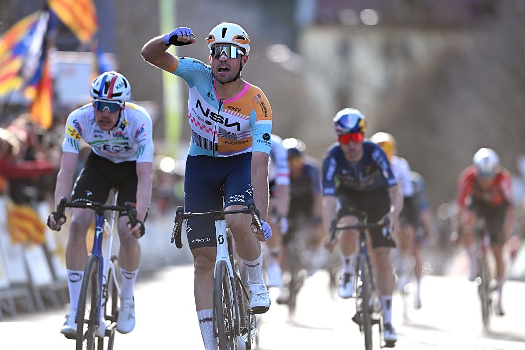 Ethan Vernon celebrates at finish line as stage winner ahead of Dorian Godon