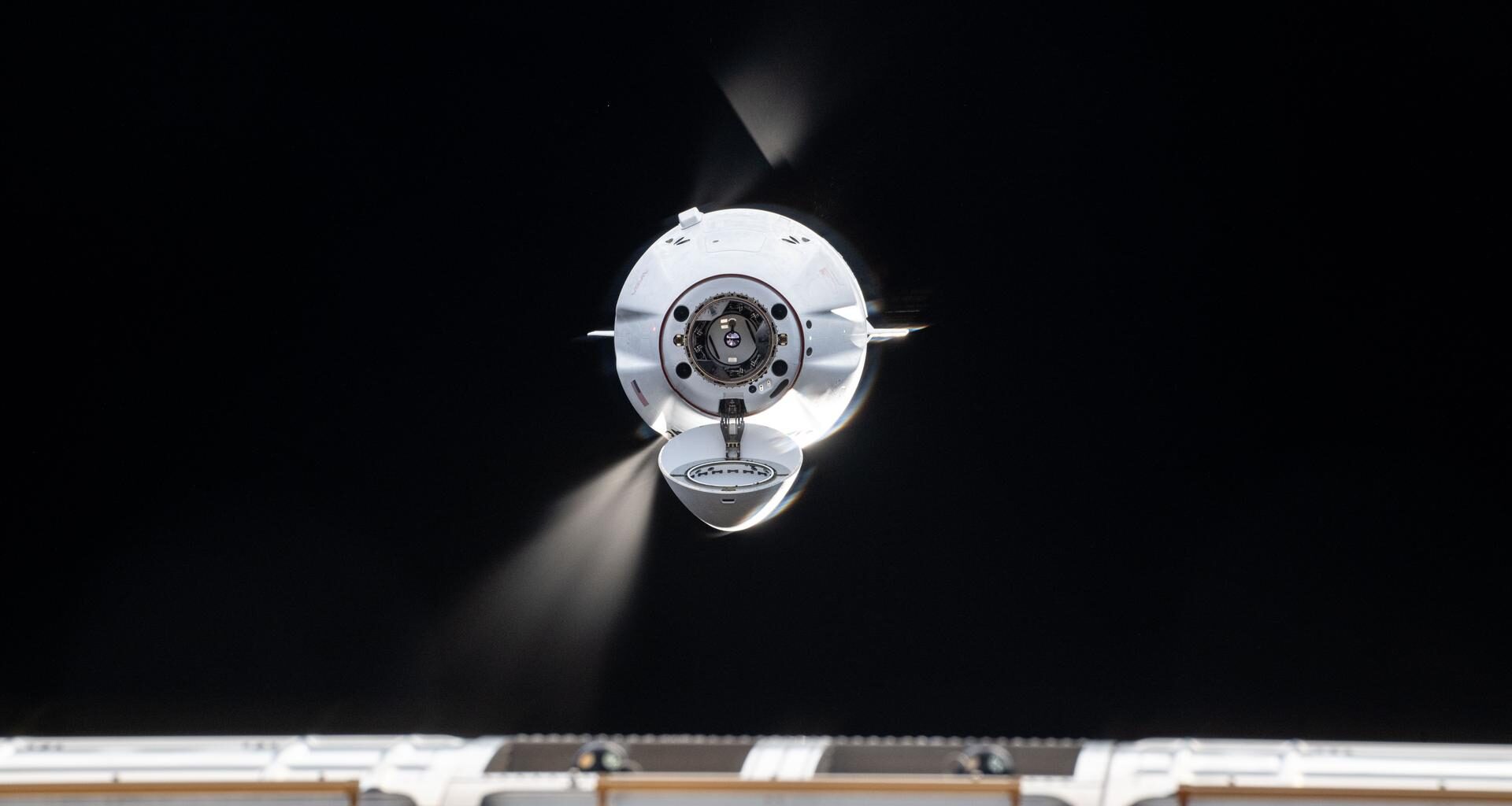 The SpaceX Dragon cargo spacecraft fires its Draco engines fine-tuning its automated approach and rendezvous with the International Space Station. Dragon would dock a few moments later to the Harmony module's forward port delivering over 5,000 pounds of science, supplies, and hardware to the Expedition 73 crew.