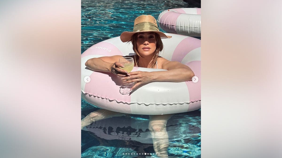 Jennifer Lopez in an innertube in the pool on Memorial Day 2026.