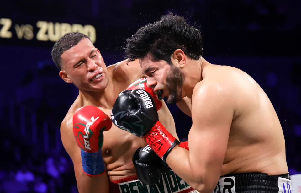 David Benavidez (L) punches WBA/WBO cruiserweight champion Gilberto Ramirez during a title fight at T-Mobile Arena on May 02, 2026 in Las Vegas, Nevada. Benavidez took the titles with a sixth-round TKO