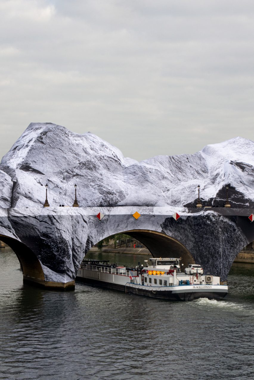 Boat passing beneath La Caverne du Pont Neuf by JR