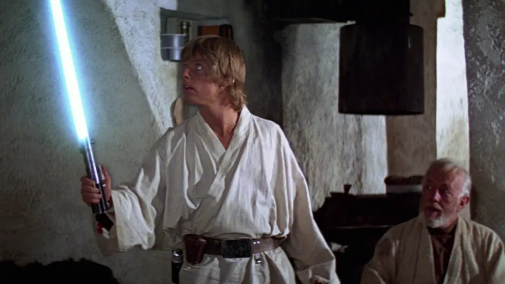 Luke wielding a lightsaber.