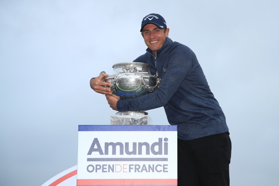 Nicolas Colsaerts of Belgium celebrates with the trophy following Day 4 of the Open de France at Le Golf National on October 20, 2019 in Paris, France.