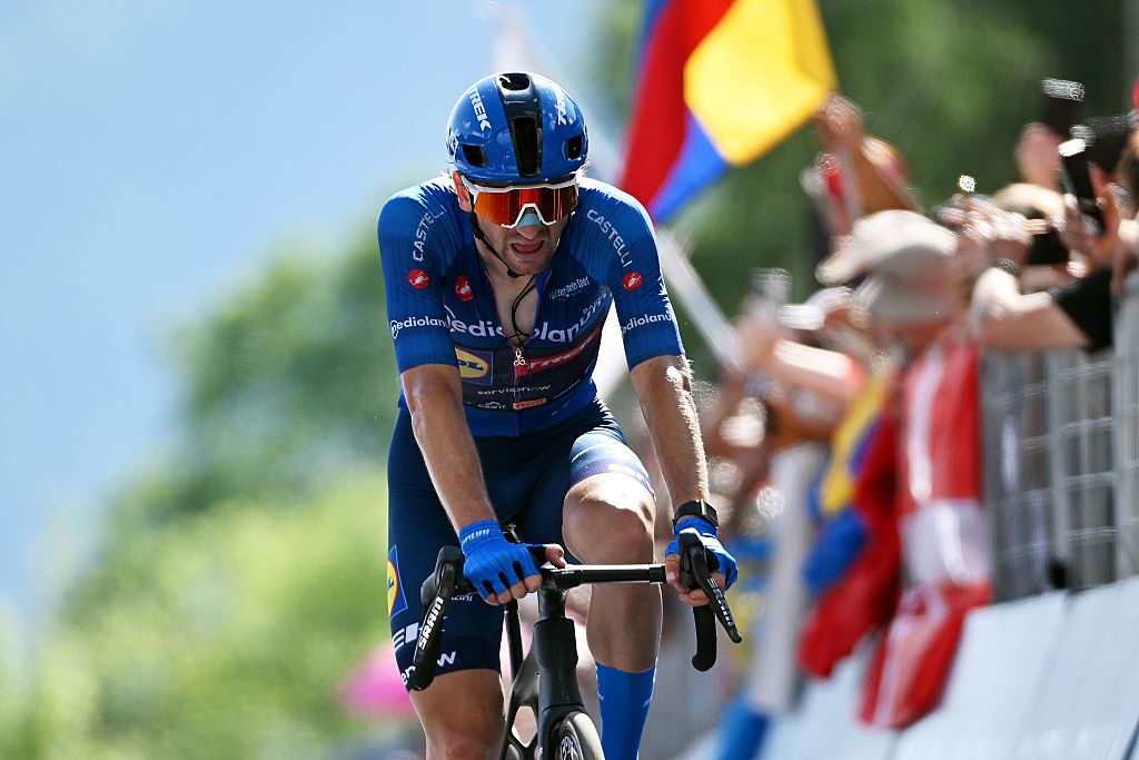 Ciccone finishing the stage with cheering fans in the background