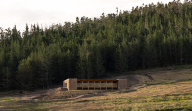 earth-toned concrete bike refuge emerges from ecuador’s landscape