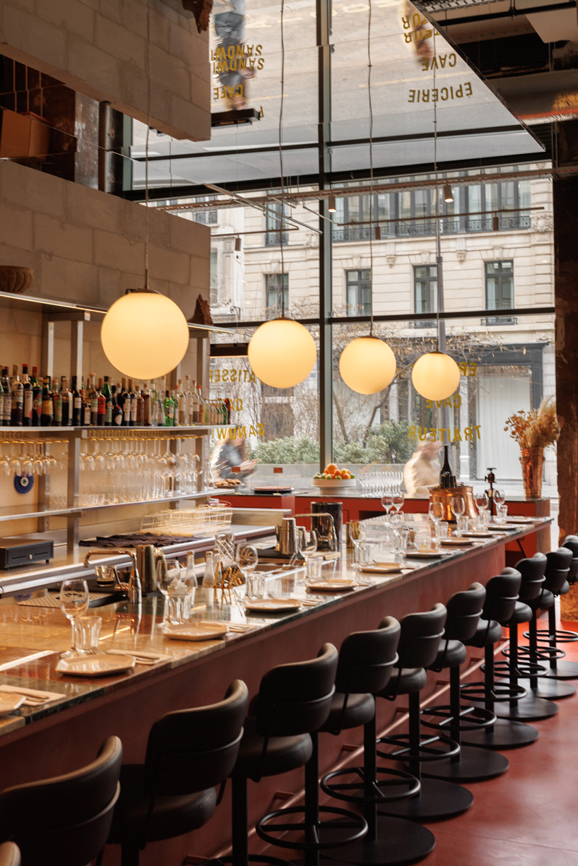 red floor anchors parisian restaurant ypseli with steel and marble textures - 3