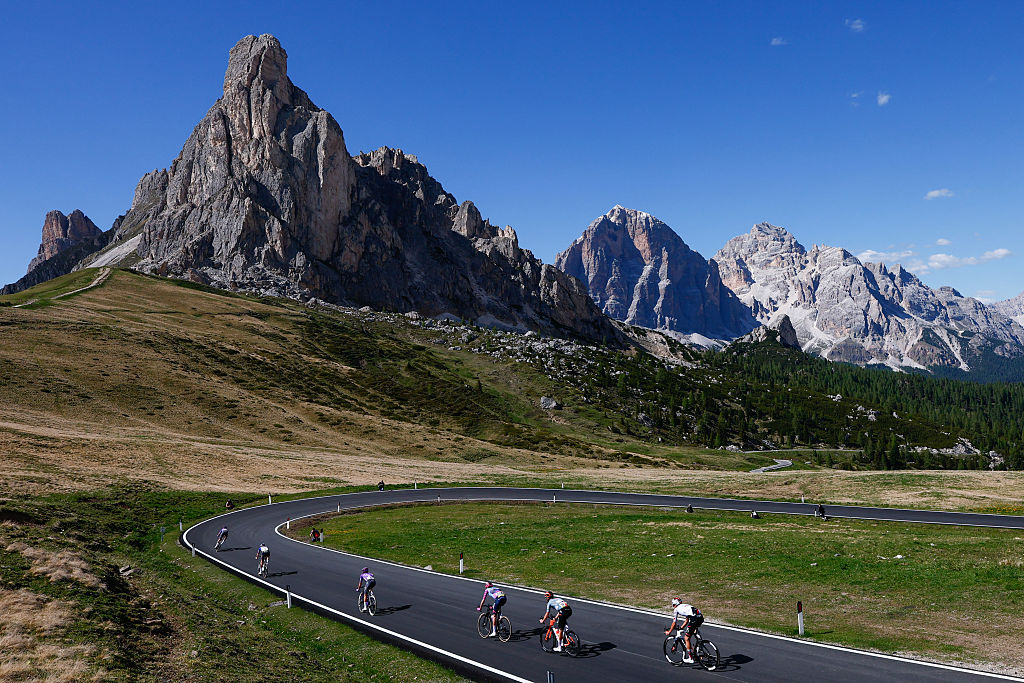 Riders cycle in the descent of Passo Giau during the 19th stage of the Giro d'Italia 2026 - Tour of Italy cycling race between Feltre and Alleghe, Italy, on May 29, 2026. (Photo by Luca Bettini / AFP)