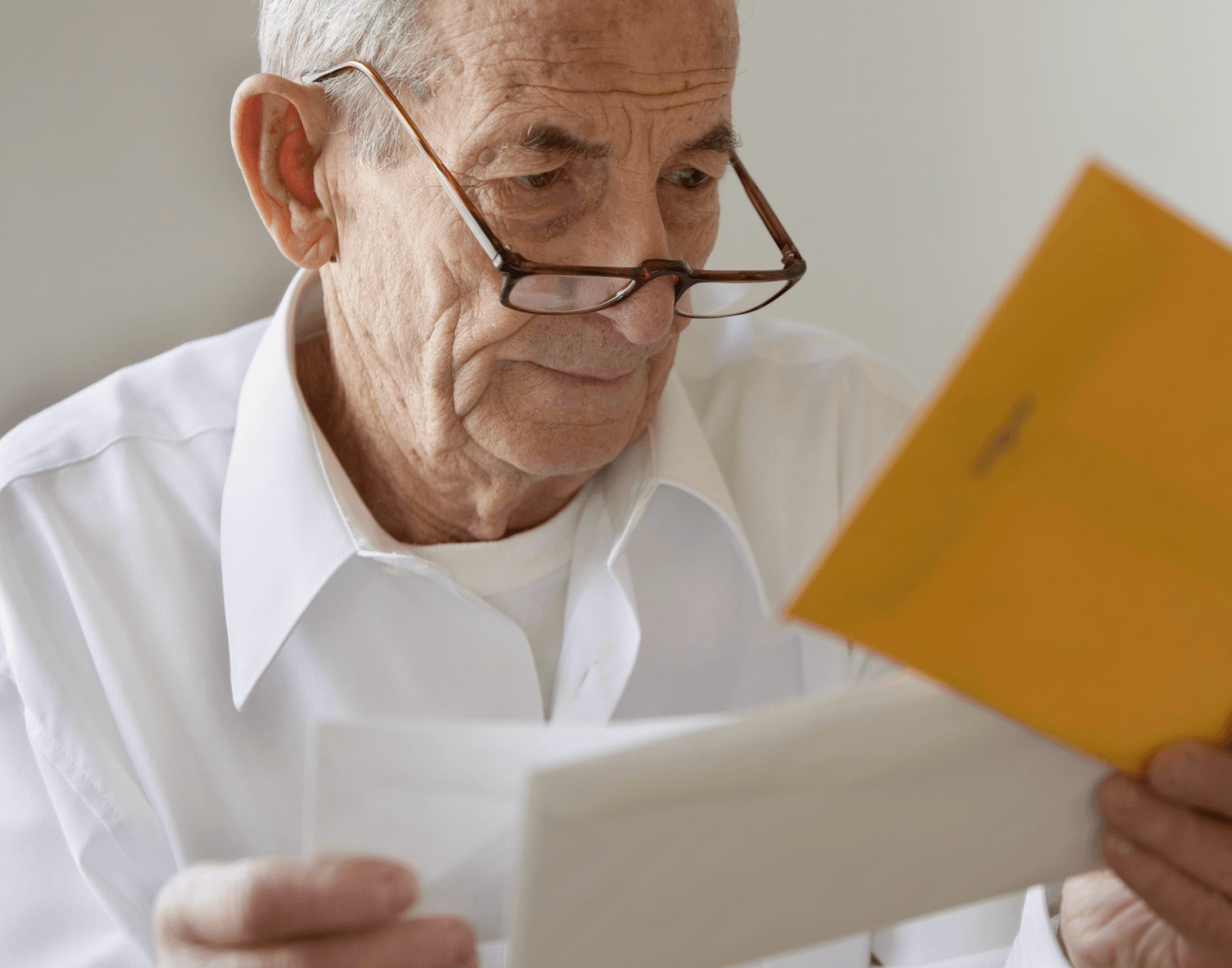 Retiree reading his letters (left), Torston Bell (right)
