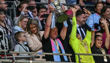 Man City boss Andree Jeglertz lifts the Women's FA Cup - his second trophy this season