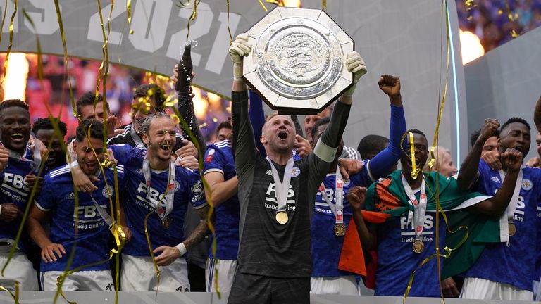 Kasper Schmeichel lifts the Community Shield after Leicester's win over Manchester City