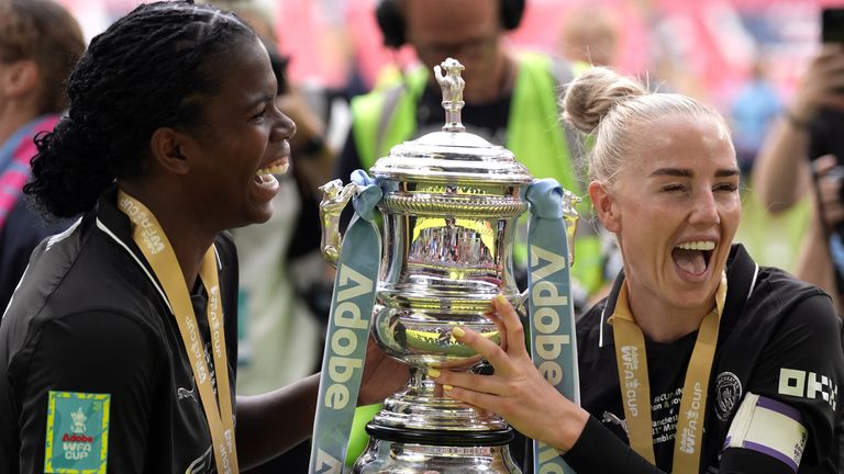 Khadija Shaw and Alex Greenwood with the FA Cup trophy
