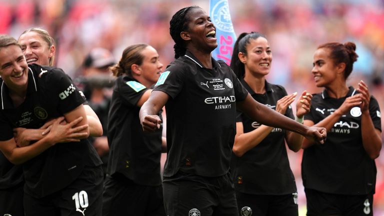 Khadija 'Bunny' Shaw celebrates in front of the Man City fans after winning the FA Cup