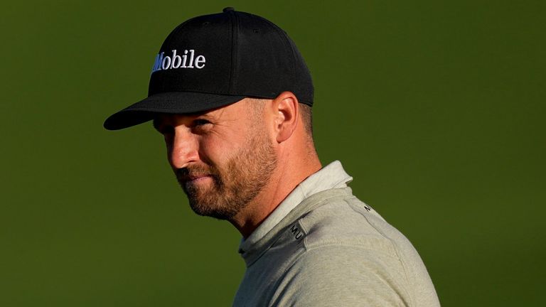 Wyndham Clark waves after his putt on the second hole during the second round of the Masters