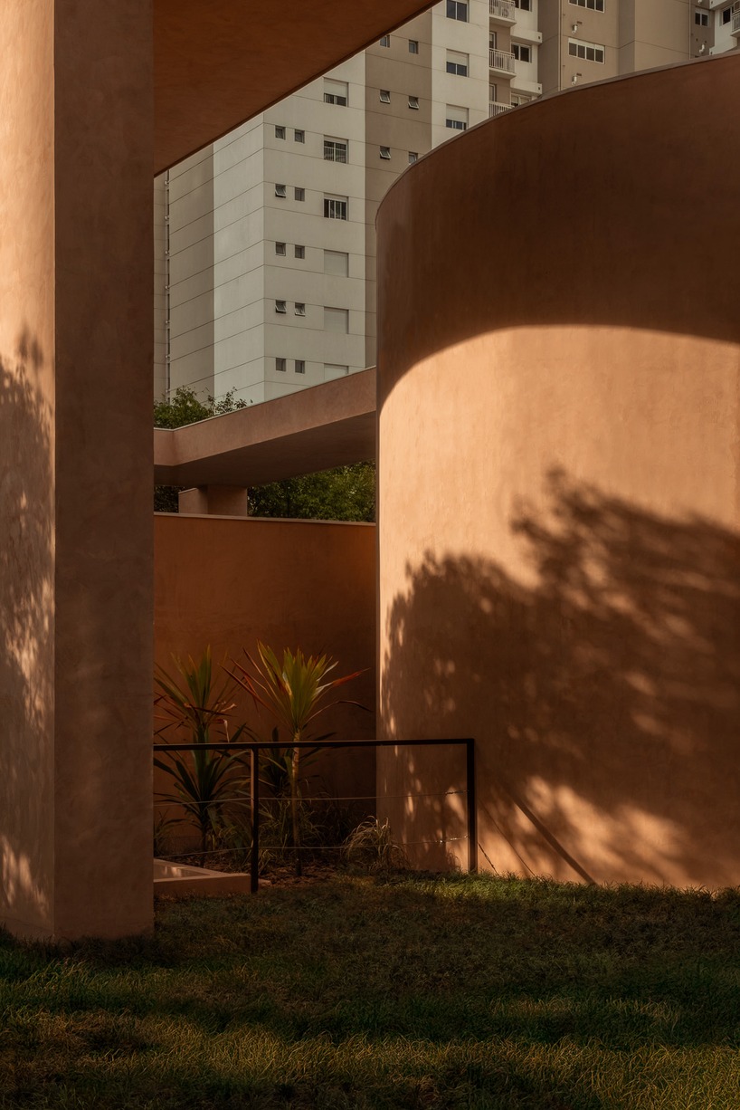 monochromatic concrete geometry shapes temporary pavilion in são paulo - 9