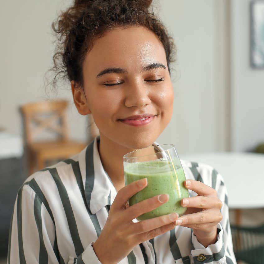 woman drinking fruit smoothie