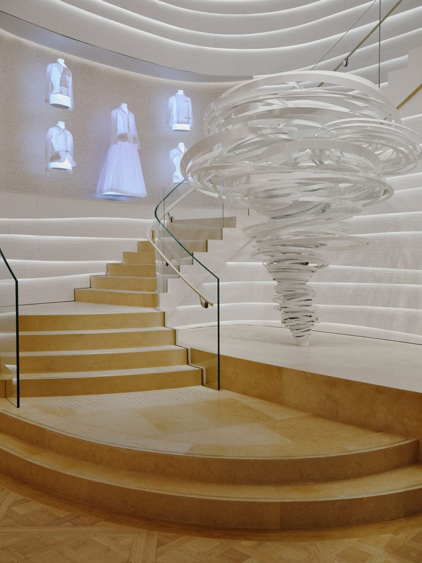 Undulating staircase with artwork