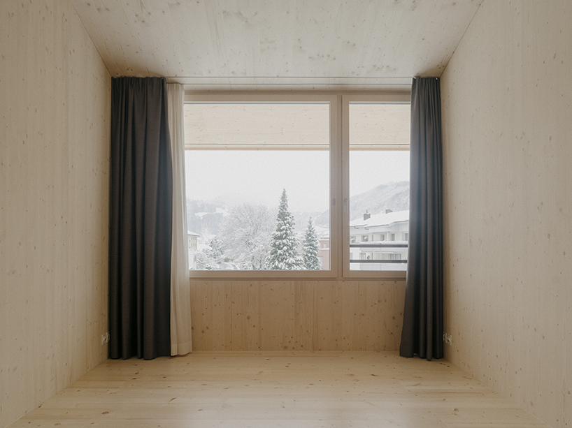 the tower house explores vertical living through prefabricated timber design 12