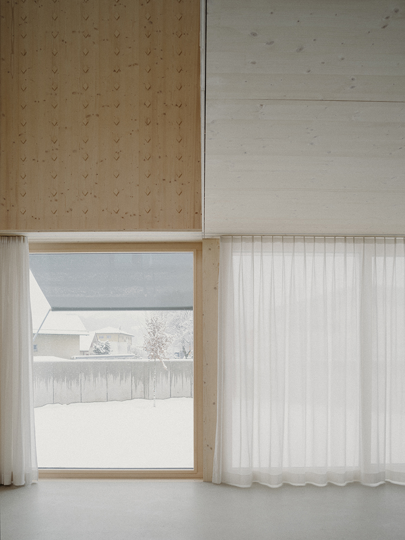 the tower house explores vertical living through prefabricated timber design 8