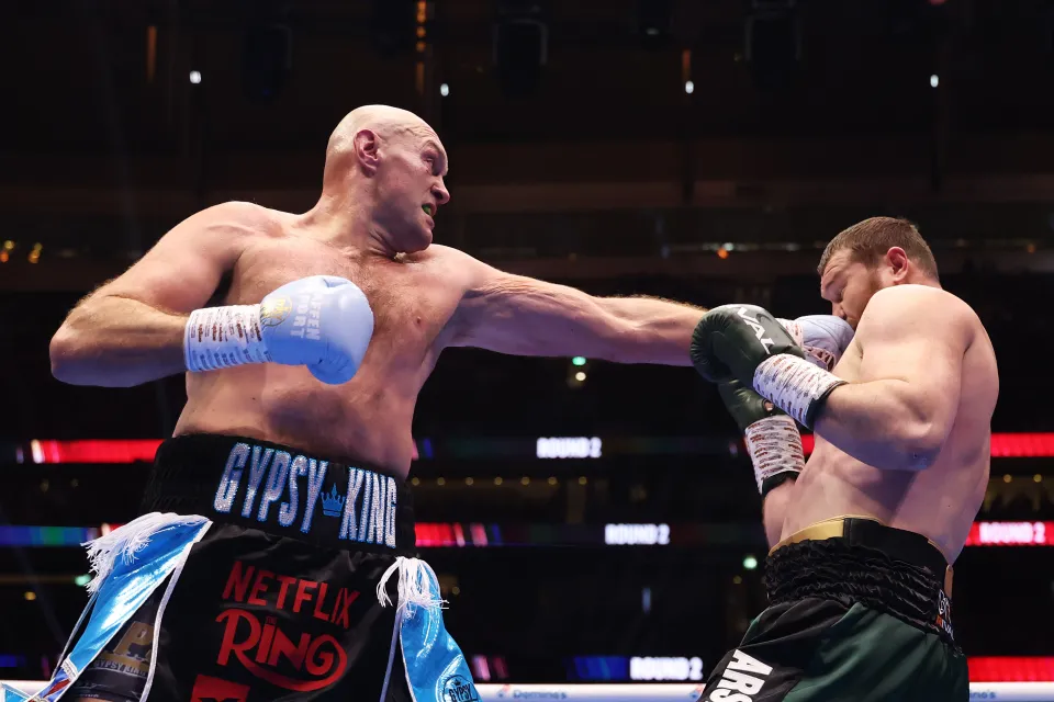 Tyson Fury punches Arslanbek Makhmudov during the Heavyweight fight between Tyson Fury and Arslanbek Makhmudov at Tottenham Hotspur Stadium on April 11, 2026 in London, England