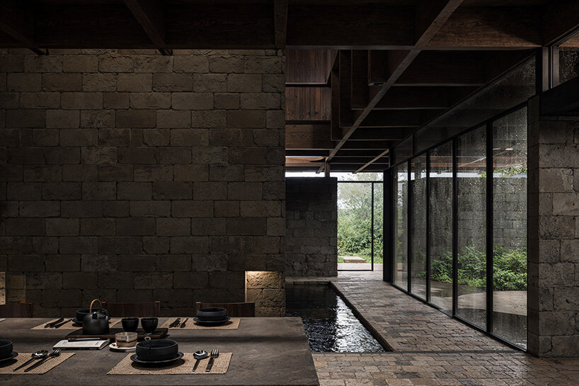 V taller proposes forest retreat around monolithic stone core for NOT A HOTEL in japan - 6