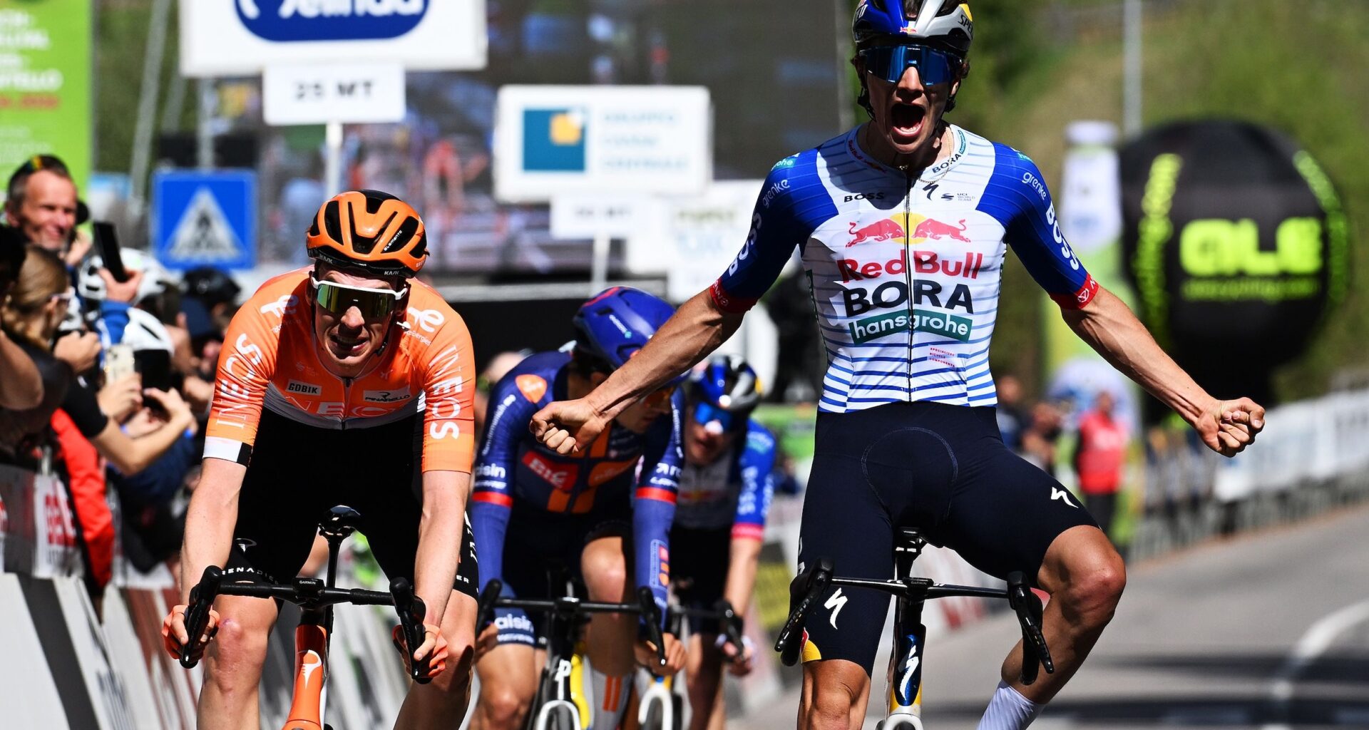 Giulio Pellizzari of Italy and Team Red Bull - BORA - hansgrohe celebrates at finish line as stage winner (R) ahead of Thymen Arensman of Netherlands and Team INEOS Grenadiers (L) during the 48th Tour of the Alps 2026, Stage 2