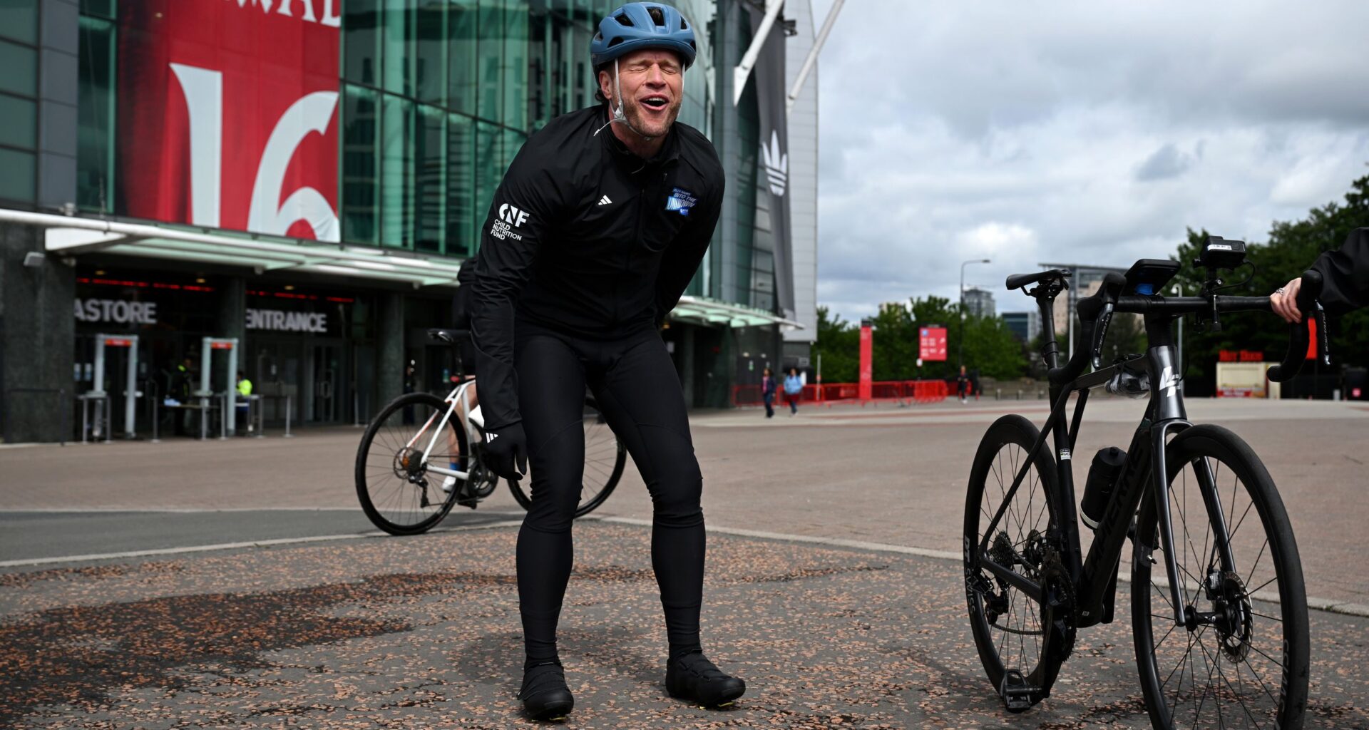 'It's been brutal' – Olly Murs cycles through torrential rain and the pain of a lost toenail to raise money for Unicef