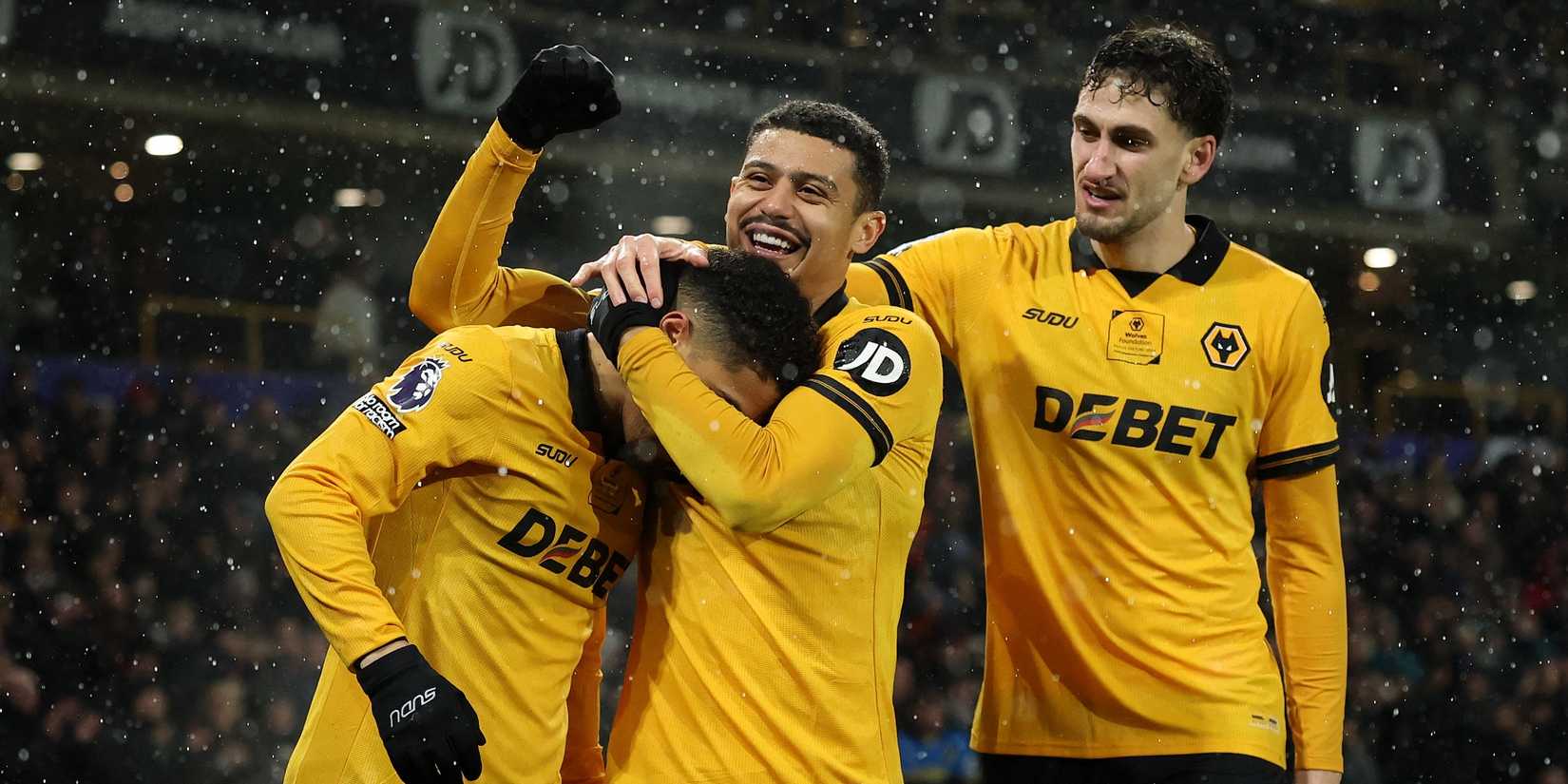 Wolverhampton Wanderers' Joao Gomes celebrates scoring their first goal with Andre and Santiago Bueno
