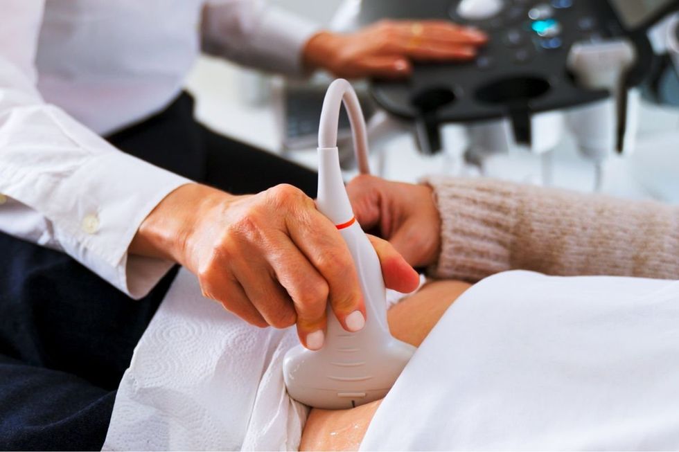 WOMAN UNDERGOING SCAN