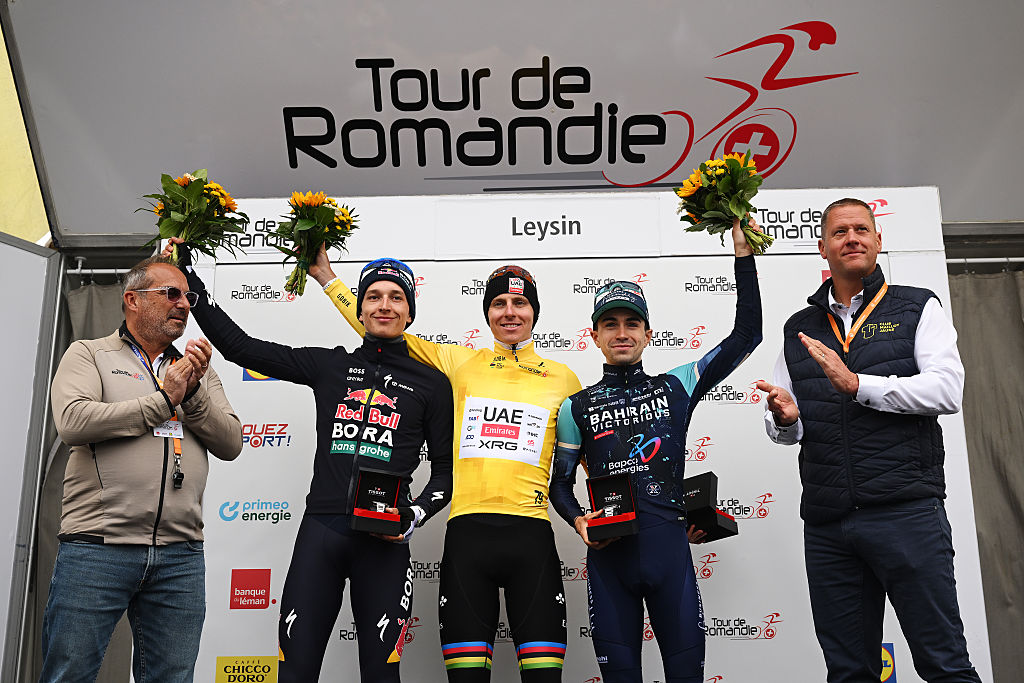 LEYSIN, SWITZERLAND - MAY 03: (L-R) Florian Lipowitz of Germany and Team Red Bull - BORA - hansgrohe on second place, race winner Tadej Pogacar of Slovenia and UAE Team Emirates - XRG - Yellow Leader Jersey and Lenny Martinez of France and Team Bahrain - Victorious on third place pose on the podium ceremony after the 79th Tour de Romandie 2026, Stage 5 a 178.2km from Lucens to Leysin 1312m / #UCIWT / on May 03, 2026 in Leysin, Switzerland. (Photo by Dario Belingheri/Getty Images)