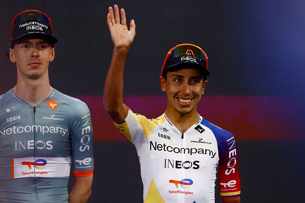 Egan Bernal smiles and waves on stage during the Giro d'Italia team presentation