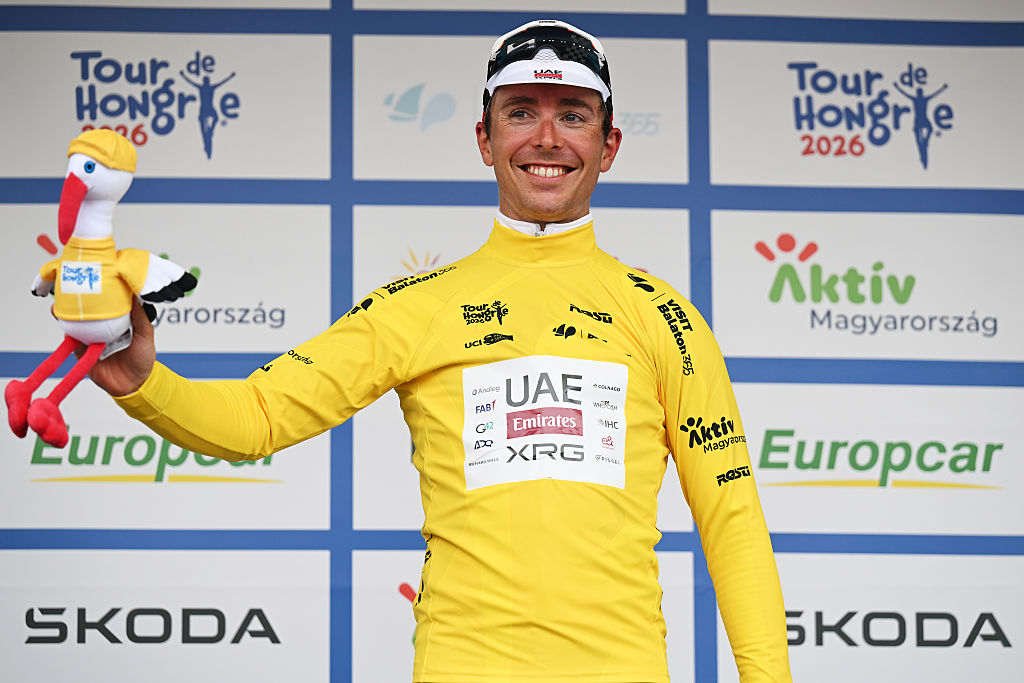 PAKS, HUNGARY - MAY 14: Benoit Cosnefroy of France and UAE Team Emirates - XRG celebrates at podium as Yellow Leader Jersey winner during the 47th Tour of Hungary 2026, Stage 2 a 205.8km stage from Szarvas to Paks on May 14, 2026 in Paks, Hungary. (Photo by Luc Claessen/Getty Images)