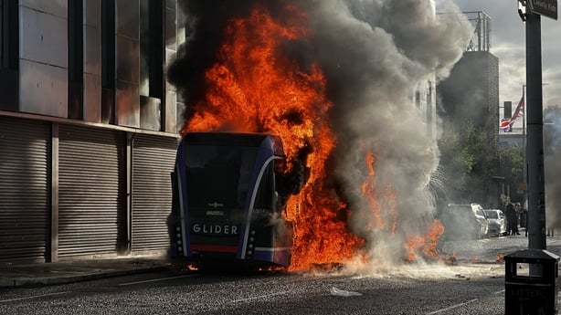 A Glider bus, set fire by protesters, on the Newtownards Road in east Belfast, as disorder flared during an anti-immigration demonstration organised in response to Monday night's stabbing attack in the city. A 30 year-old man arrested in connection with the Belfast stabbing attack has been charged w