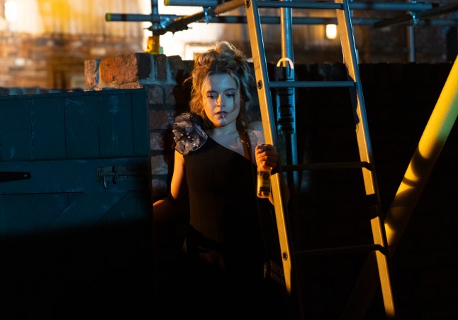Betsy Swain screaming beneath some scaffolding in Coronation Street
