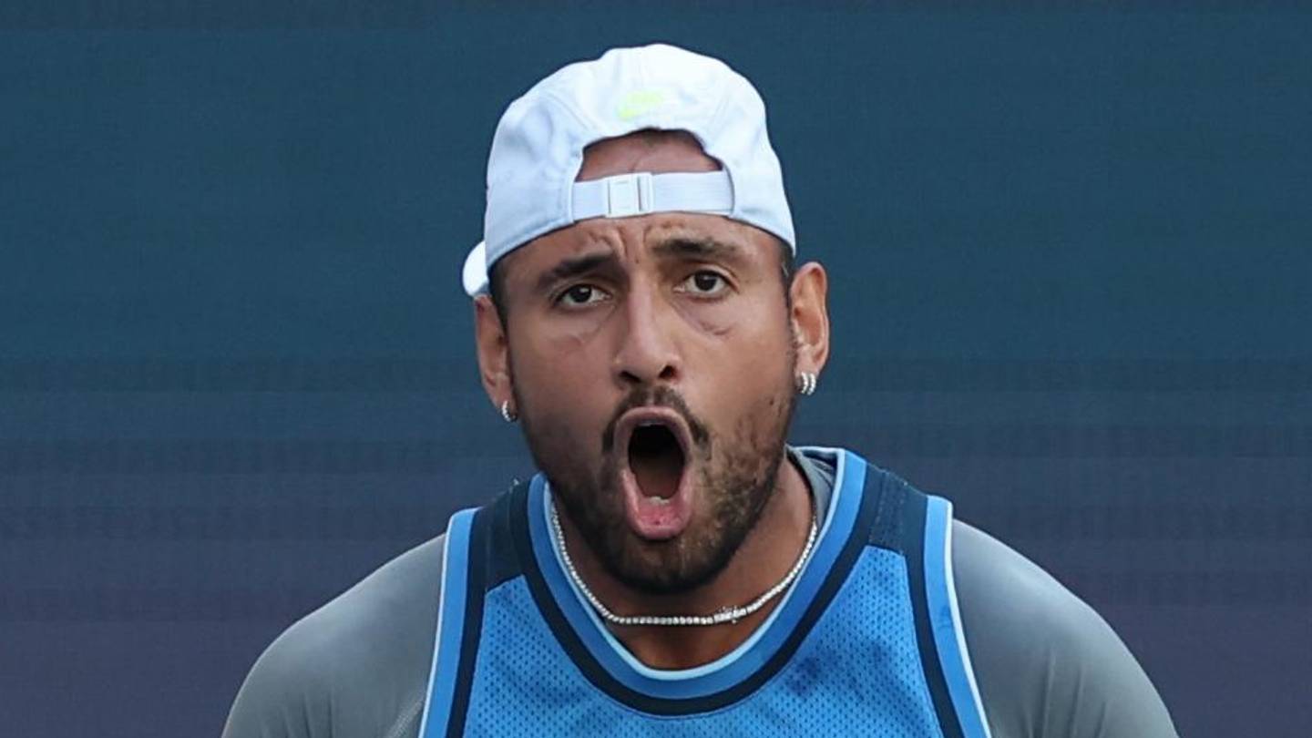 Nick Kyrgios reacts after winning a point