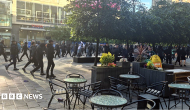 Large crowds wearing black march through Glasgow city centre