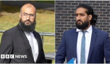 A composite image of the drivers. On the left, Photograph showing Umar Ben Yusaf, who wears a black two piece suit, a pale grey tie and white shirt. He has a bald head and a brown long haired beard. He is leaving Mold Crown Court and his jacket blows in the wind. Grass can be seen behind him, as well as boulders and bins. On the right, Photograph showing Abubakr Ben Yusaf, who wears a navy two piece suit, a blue tie and white shirt. He has brown long hair and a brown long haired beard. He is leaving Mold Crown Court and holds a blue folder under his left arm.