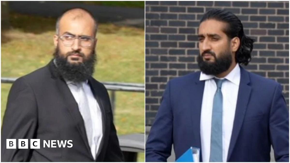 A composite image of the drivers. On the left, Photograph showing Umar Ben Yusaf, who wears a black two piece suit, a pale grey tie and white shirt. He has a bald head and a brown long haired beard. He is leaving Mold Crown Court and his jacket blows in the wind. Grass can be seen behind him, as well as boulders and bins. On the right, Photograph showing Abubakr Ben Yusaf, who wears a navy two piece suit, a blue tie and white shirt. He has brown long hair and a brown long haired beard. He is leaving Mold Crown Court and holds a blue folder under his left arm.