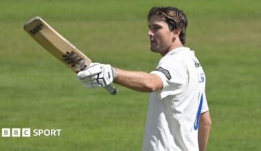 James Coles raises his bat against Glamorgan