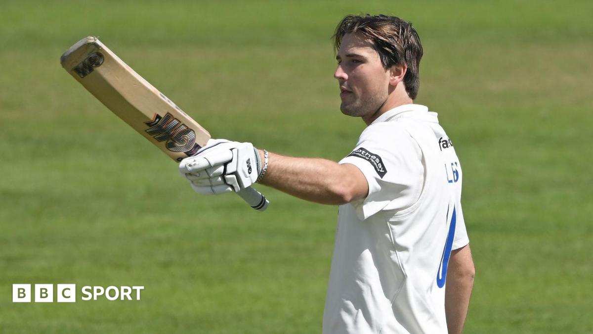 James Coles raises his bat against Glamorgan