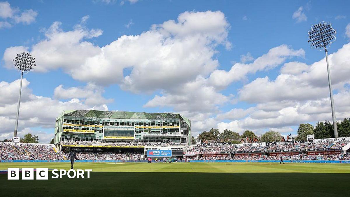 Headingley Cricket Ground with the pavilion in the centre and floodlights either side.