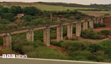 A landscape view of the abandoned bridge in Ponte do Esqueleto with fields surrounded the infastructure