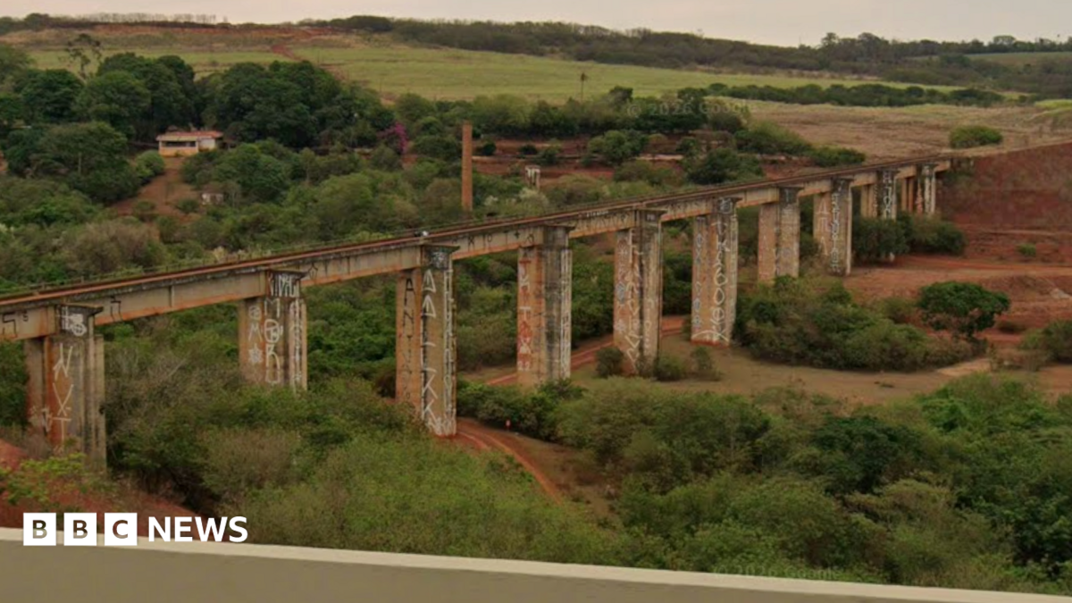A landscape view of the abandoned bridge in Ponte do Esqueleto with fields surrounded the infastructure