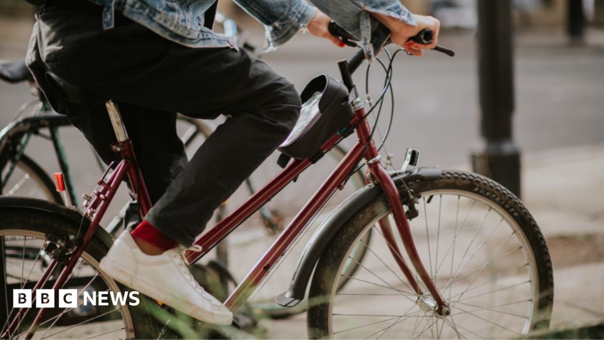 A stock image of someone on a bike. Only their legs are visible.