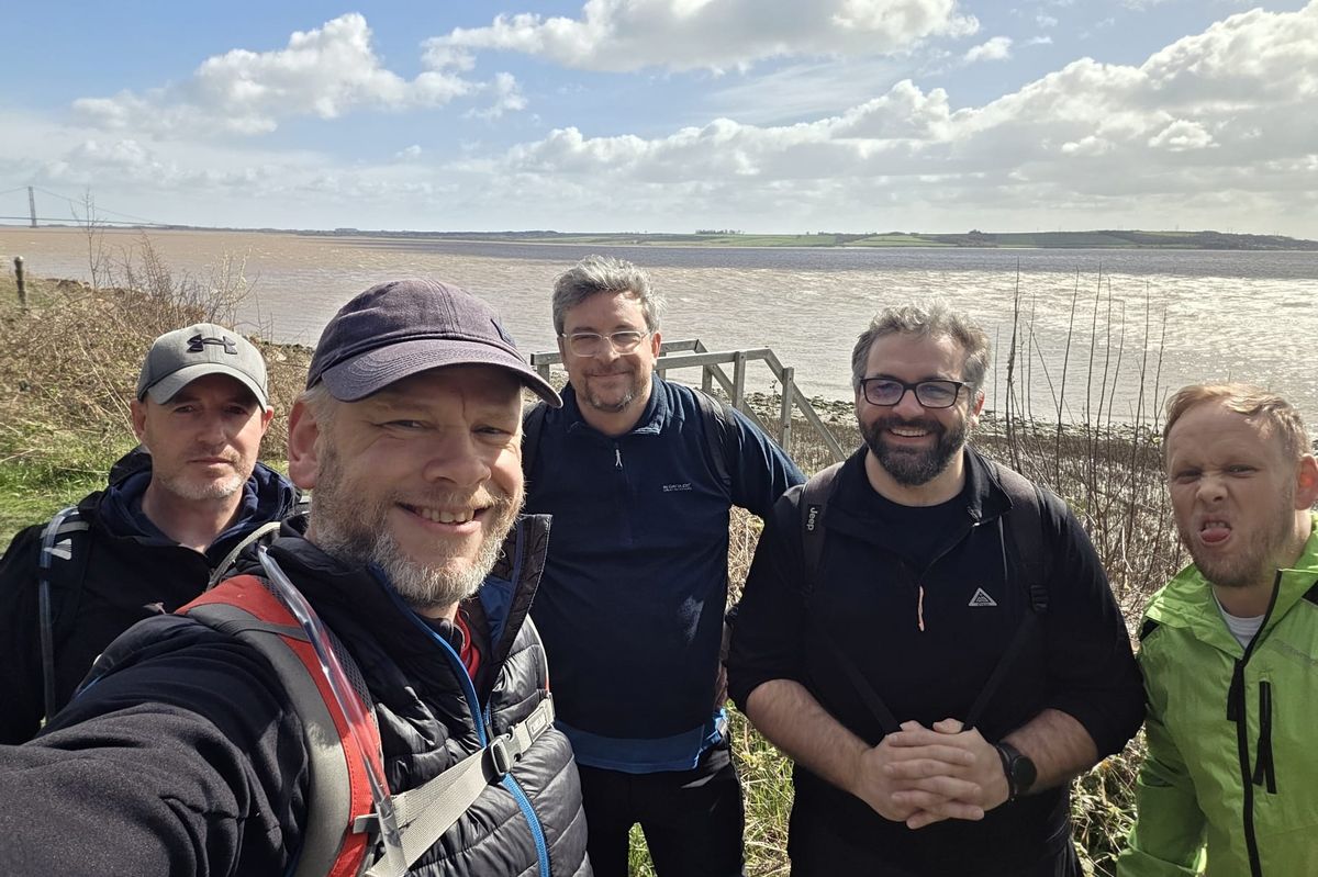 Five of the walkers on a practice walk by the river Humber