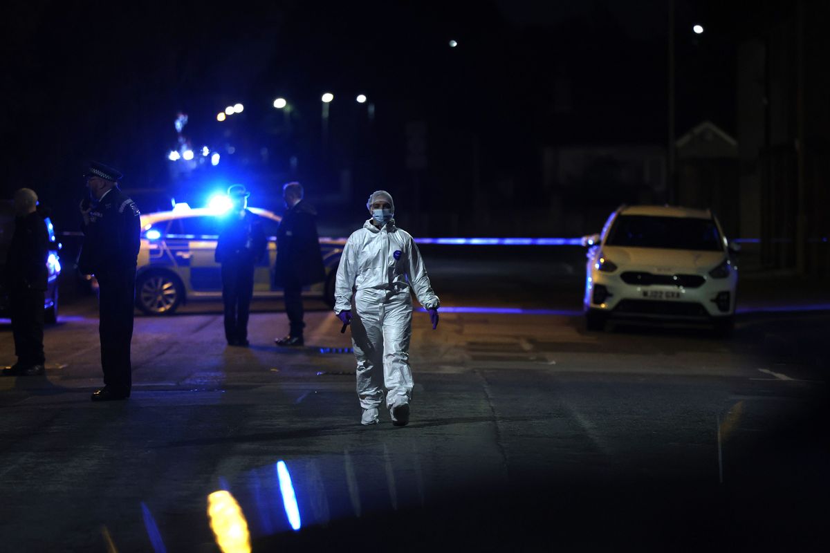 Forensic officers working at the scene on June 3