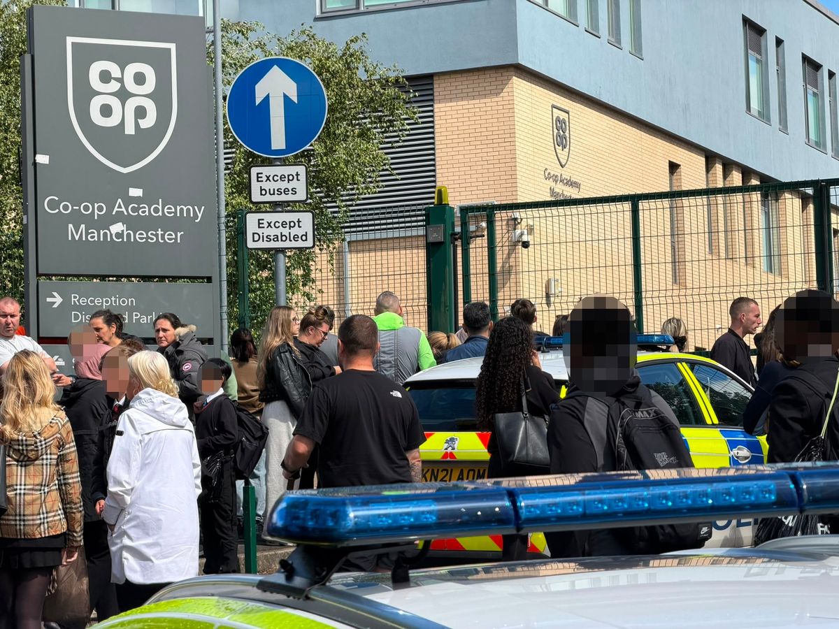 Police outside the Co-op Academy Manchester in Blackley 